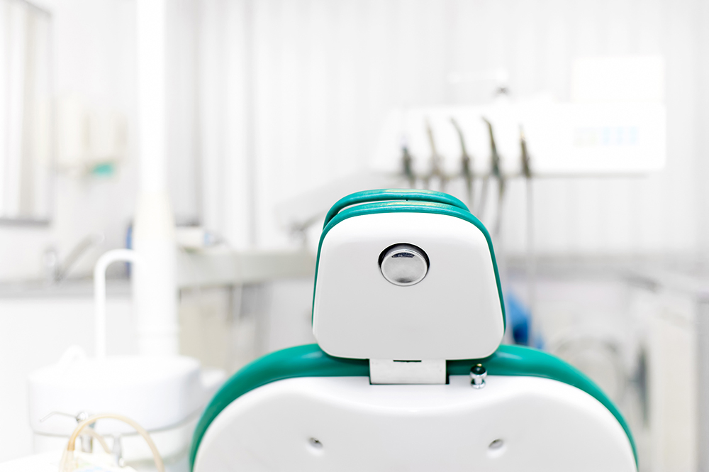 Dentist office with tools, professional dentist chair and equipm Dentist office with tools, professional dentist chair and equipm